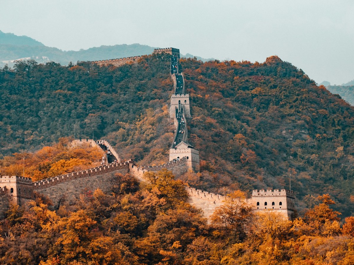 The Great Wall winding across forested mountains near Beijing