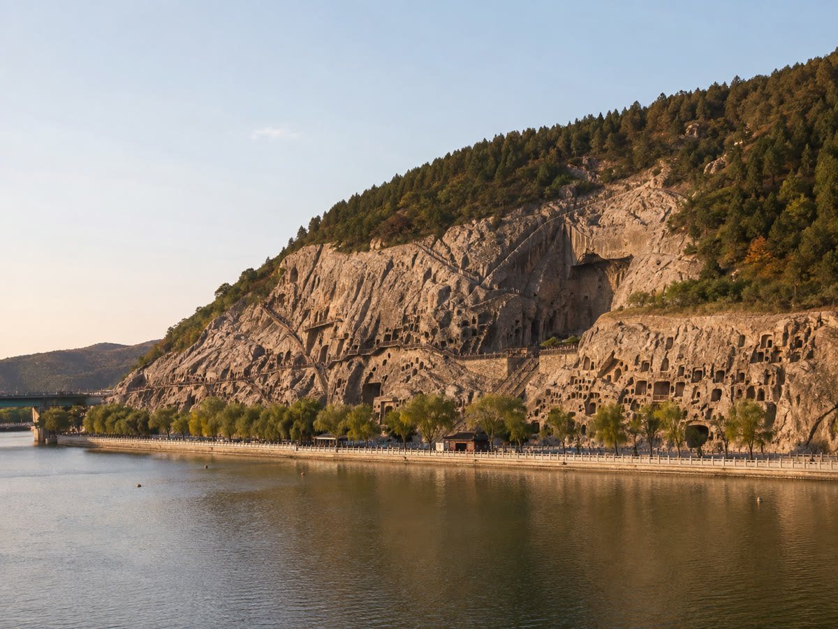 The Longmen Grottoes cliff and cave niches beside the Yi River in Luoyang