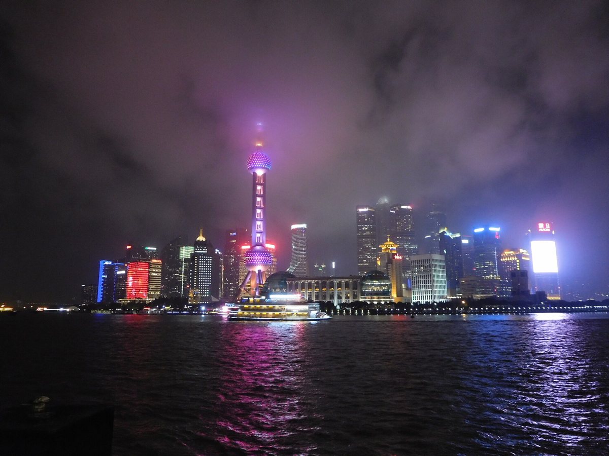 Shanghai's illuminated Lujiazui skyline across the Huangpu River from the Bund
